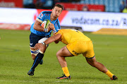 Lucas Boguera of the Jaguares tackles Handre Pollard (L) of the Bulls during the Super Rugby match between Vodacom Bulls and Jaguares at Loftus Versfeld on April 15, 2017 in Pretoria, South Africa.