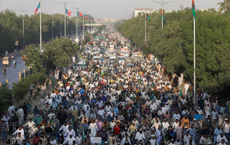 Supporters of religious and political party Tehreek-e-Labaik Pakistan march during a protest against the cartoon publications of Prophet Mohammad in France and comments by the French President Emmanuel Macron, in Karachi, Pakistan on November 7, 2020. File photo