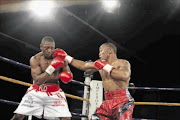 MAKING A COMEBACK: Thabiso Mchunu punishes Flo Simba in an earlier fight
      
      
      PHOTO: Bafana Mahlangu