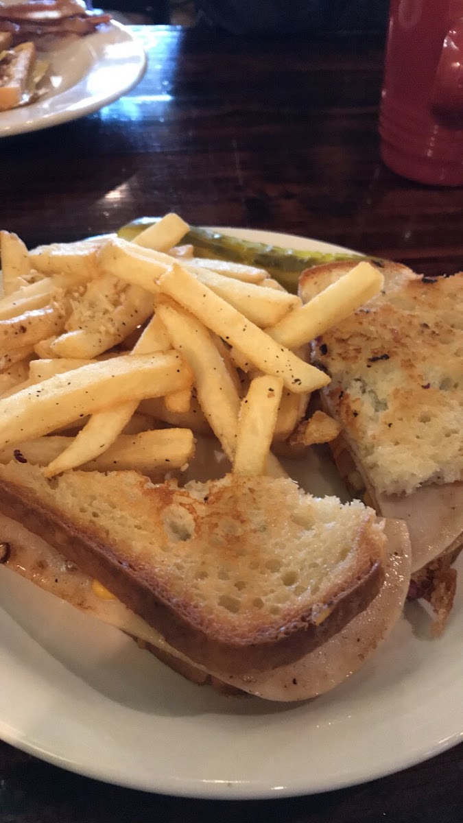 Turkey melt with caramelized onions and red peppers on gluten free bread and fries! Love this place 
Fresh infused water had mango/ pineapple water this time