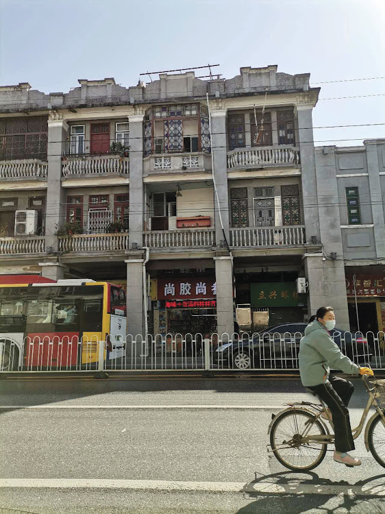 Older part of town, now buzzing streets with shops.