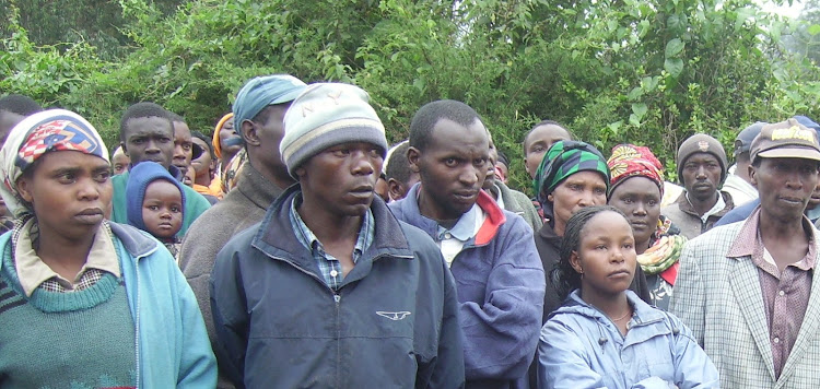 Residents of Kambaa village in Lari sub county mill at their shopping center to witness the body of the lynched suspected thug.