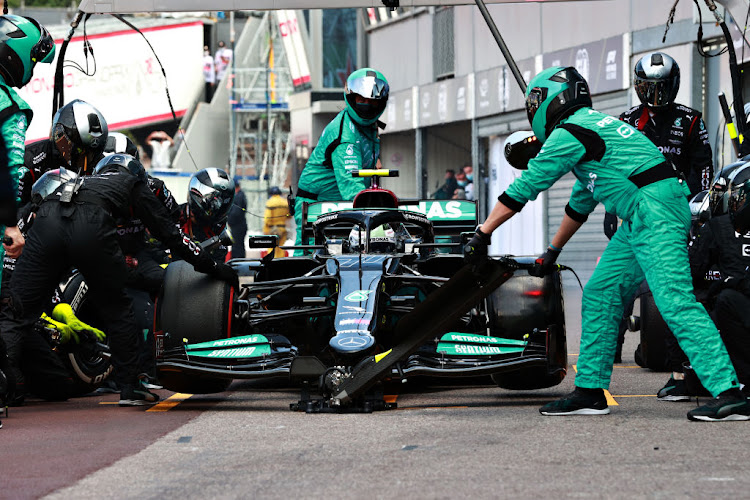 Valtteri Bottas of Finland makes a pitstop but his front right wheel is stuck on his car leading to his retirement from the race during the F1 Grand Prix of Monaco on May 23 2021.