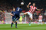  Danny Rose of Tottenham Hotspur and Ramadan Sobhi of Stoke City during the Premier League match between Stoke City and Tottenham Hotspur at Bet365 Stadium on April 7, 2018 in Stoke on Trent, England. 