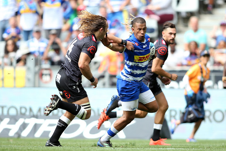 Clayton Blommetjies of the Stormers fends off a challenge from Werner Kok of the Sharks during their United Rugby Championship (URC) match at Cape Town Stadium in Cape Town, South Africa on 04 March 2023.