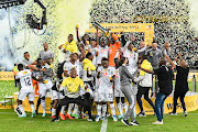 Orlando Pirates celebrate winning the MTN8 final match against AmaZulu at Moses Mabhida Stadium in Durban on November 5 2022.