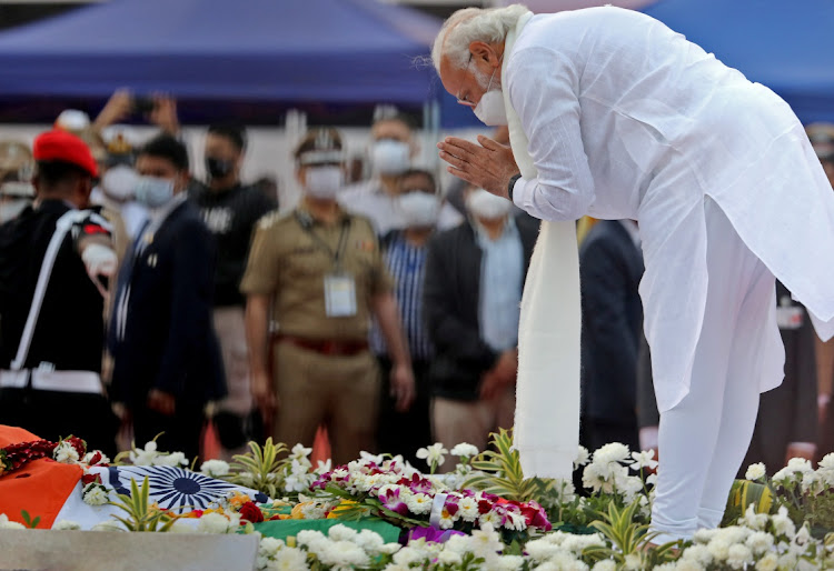 India’s Prime Minister Narendra Modi pays his respects to late Indian singer Lata Mangeshkar during her funeral at Shivaji Park in Mumbai, India, February 6 2022. Picture: NIHARIKA KULKARNI/REUTERS