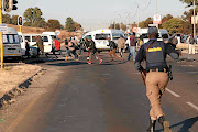 Taxi drivers flee as the Tshwane Metro Police, the SAPS and SANDF soldiers acted on  the drivers who had blockaded the R55  in Laudium, Pretoria, yesterday, preventing people from going to work during a strike over government relief fund./Thuulani Mbele