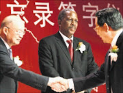 Mr. Yuan Chen, chairman of the Board: CBD and Matthews Phosa - China/Africa Development Fund opens first office in Africa, with $5-billion to spend.  pic MARIANNE SCHWANKHART 16.03.09