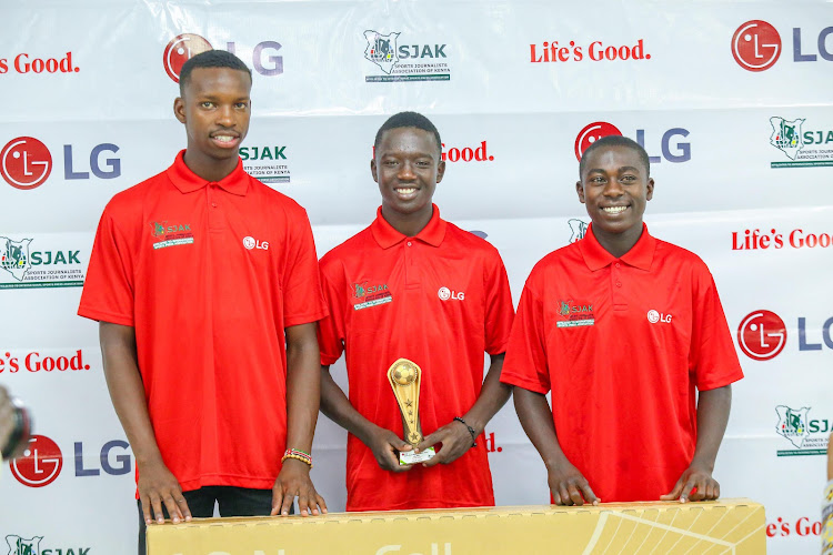 Newly-crowned SJAK/LG Sports Personality of the Month of August Aldine Kibet (C) with fellow Spain-bound youngsters Amos Wanjala (L) and Alvin Kasavuli