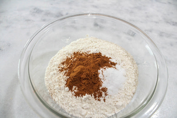 Flour, baking soda, cinnamon, and salt in a bowl.