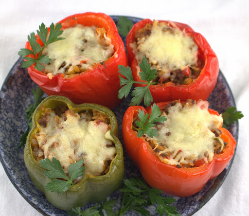 Baked bell peppers stuffed with Cajun dirty rice.