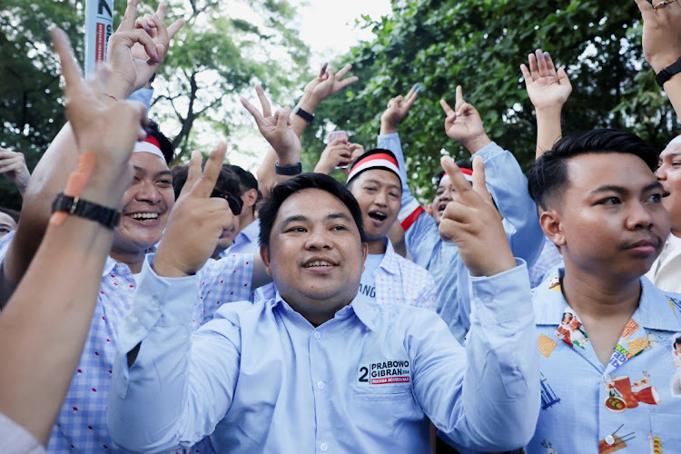 Supporters of Indonesia's Defence Minister and presidential candidate Prabowo Subianto outside his home in the capital, Jakarta, on February 14, 2024. REUTERS/AJENG DINAR ULFIANA