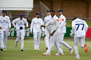 Fast bowler Sisanda Magala celebrates with his Lions teammates after taking a wicket. 