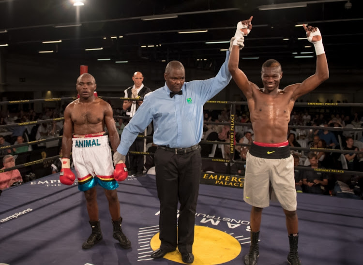 Jabulani Makhense (R) celebrates after defeating Kalela Kaduma (L) during the Junior Welterweight fight between the pair at the Golden Gloves Boxing match. File photo