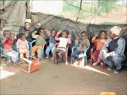 EAGER FOR WISDOM: Kids show a lot of enthusiasm to learn at day centre under tough conditions.