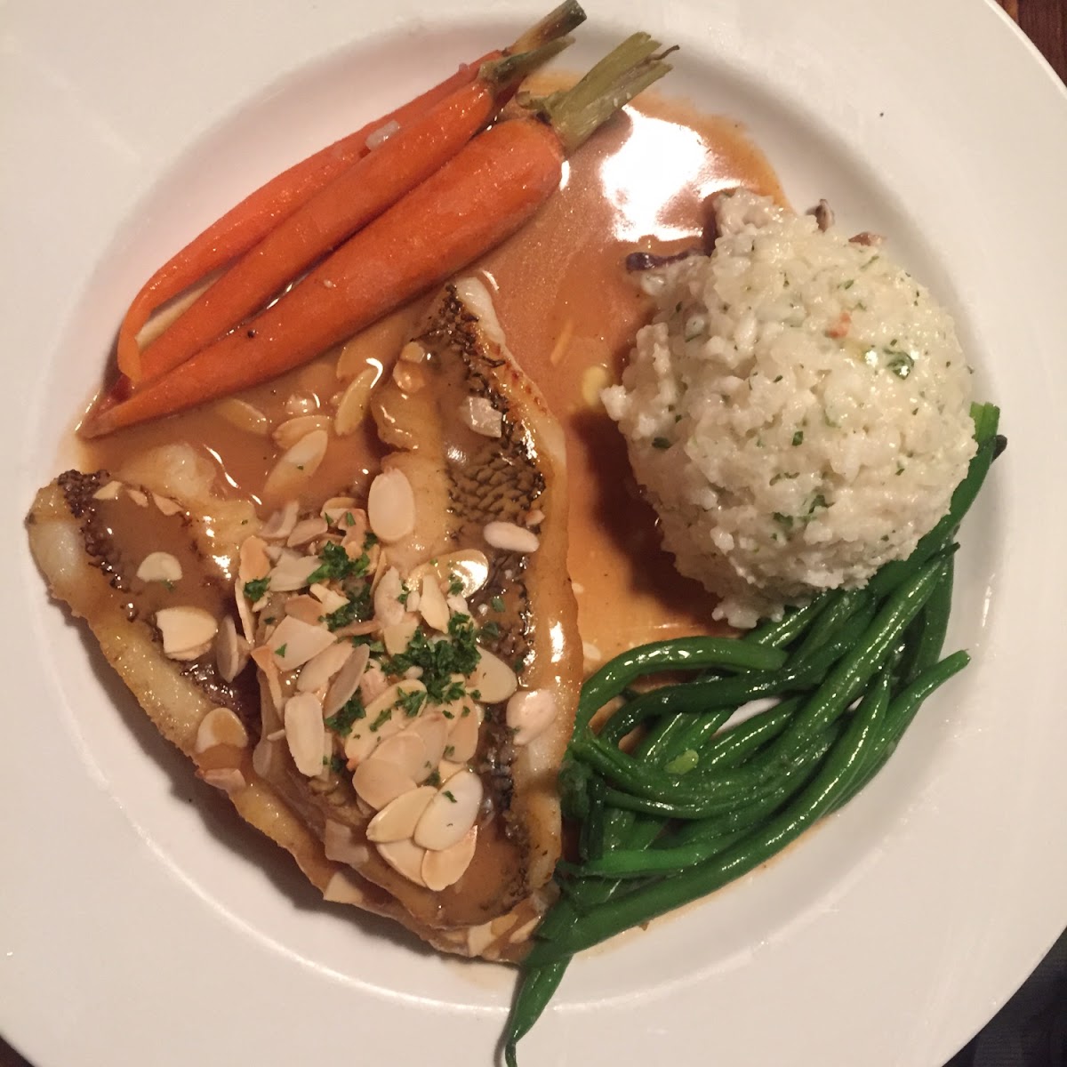 Snapper with pea risotto and baby vegetables in (gluten free) almandine sauce