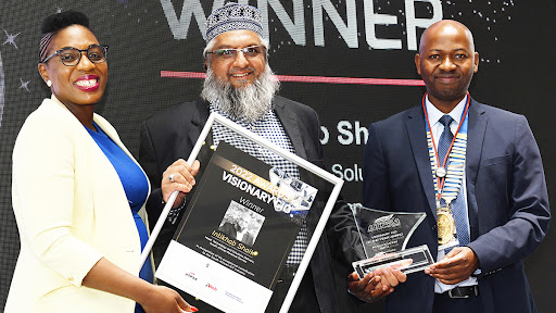 SARS head of technology and solutions delivery Intikhab Shaik (centre) accepts the Visionary CIO Award for 2022 from IITPSA president and board chairperson Admire Gwanzura, and group CIO of Barloworld Tshifhiwa Ramuthaga. (Image: Vividimages Photography)