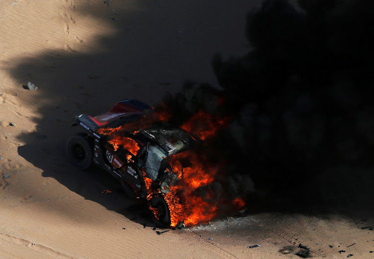 Three-times Le Mans winner Romain Dumas saw his Dakar dreams go up in smoke when his Peugeot caught fire 65km into the special stage, forcing the Frenchman's retirement.