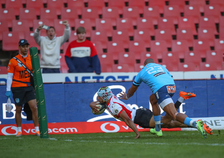 Edwill van der Merwe of the Lions scores his second try against the Bulls at Ellis Park in Johannesburg on Saturday.