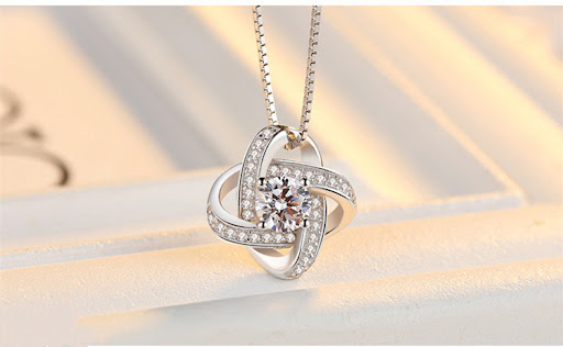 Title 4, Sterling Silver Four-Leaf Clover Necklace, a sy...