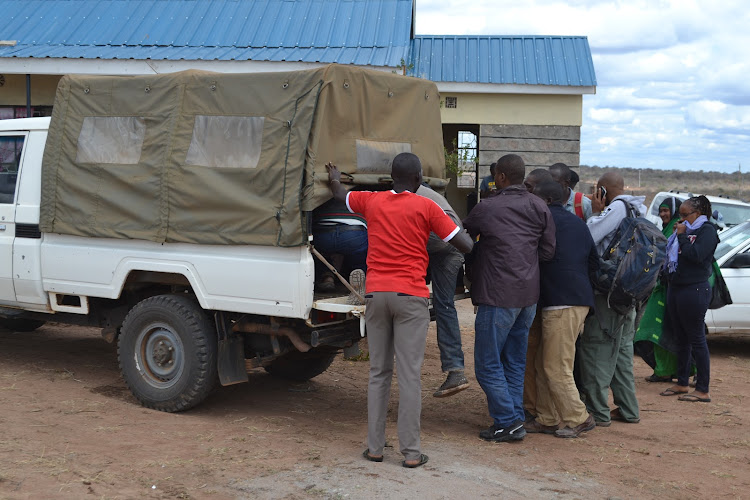 Suspects arrested in the interagency police swoop boarding a police pick up at Kanyonyoo police outpost for onward transportation to Kyusyani police sation on Wednesday.