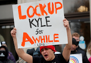 Protesters demonstrate outside the Kenosha County Courthouse, during the trial of Kyle Rittenhouse, in Kenosha, Wisconsin, US, on November 17, 2021. 
