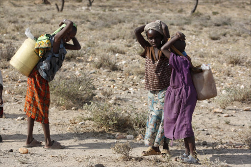 Young samburu girls carrying water on their back in samburu,the area is prone to severe drought.Photo/File