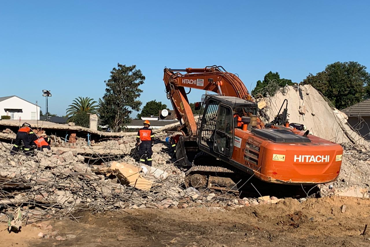 Heavy equipment has been used during the past few days to break up concrete in the search for survivors at the site of the collapsed building in George.