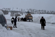 Tourists stranded as a result of avalanches hitting highways are airlifted to safety by helicopter in Burqin County, Xinjiang province, China in this screengrab from social media video released January 15, 2024.