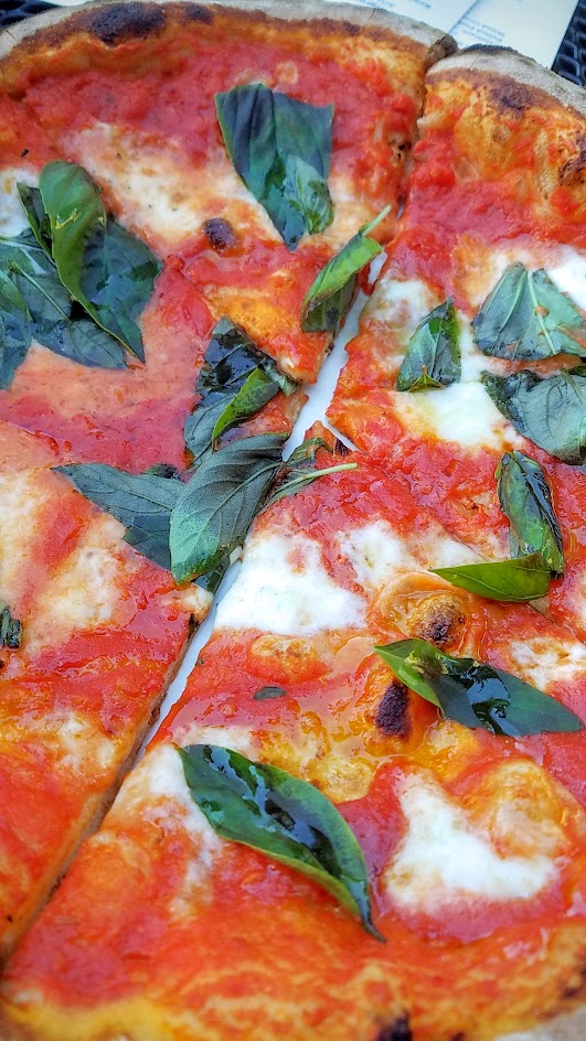 Ken's Artisan Pizza, 12 inch thin crust perfection, this one is the classic Margherita with tomato sauce, mozzarella, and basil