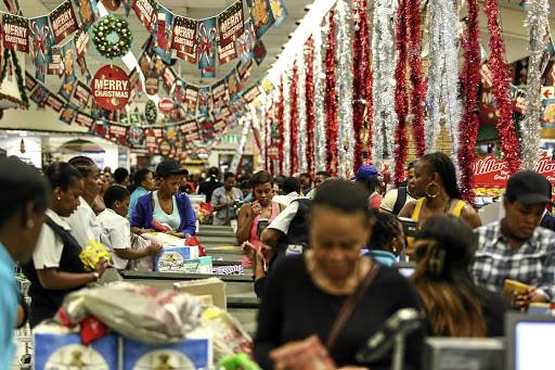 Shoppers queue at till points inside the Checkers Hyper at Sandton City in Johannesburg. The Soweto campaign of black Christmas in the 1970s called for a boycott of the holiday. /Moeletsi Mabe