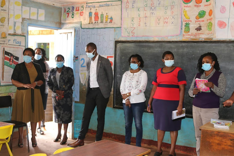 Kiambu county education officials at an ECDE centre.