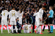 Sergio Ramos of Real Madrid, Casemiro of Real Madrid, Karim Benzema of Real Madrid, Federico Valverde of Real Madrid, Luka Modric of Real Madrid, Raphael Varane of Real Madrid, referee Daniele Orsato during the UEFA Champions League  match between Real Madrid v Manchester City at the Santiago Bernabeu on February 26, 2020 in Madrid Spain. 