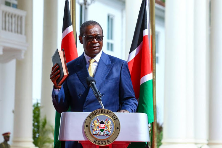 Former Nairobi Governor Evans Kidero taking oath at State House on March 23, 2023