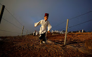 A member of the Samaritan sect takes part in a traditional pilgrimage marking the holiday of Shavuot, atop Mount Gerizim, near Nablus, Palestine.