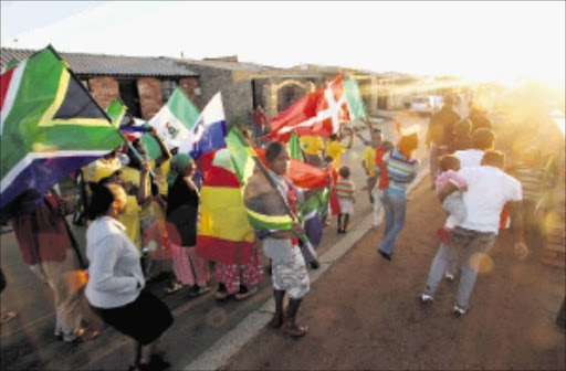 The Soweto resident in Naledi Mojalefa street but up flags outside there house to celebrate world cup .PIC. ELIZABETH SEJAKE. 10/05/2010.© THE TIMES