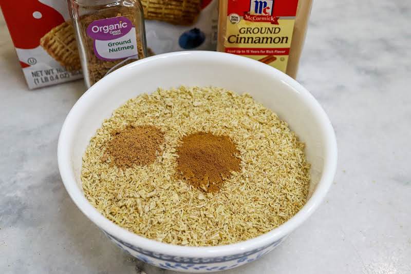 Adding Spices To The Shredded Wheat Crumbs.