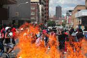 Students close down the streets of Braamfontein as they fight for the clearance of historical debt for students, among other demands.