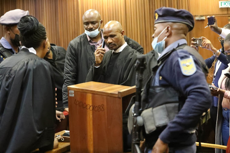 Adv MaleselaTeffo making a phone call following his surprise arrest in North Gauteng High Court in Pretoria. Picture: ANTONIO MUCHAVE