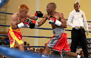 Simpiwe Konkco in action during his IBO mini flyweight title defence bout against Filipino Joey Canoy at the Orient Theatre in East London on December 2 last year. The fight was declared a no-contest after an accidental clash of heads. 