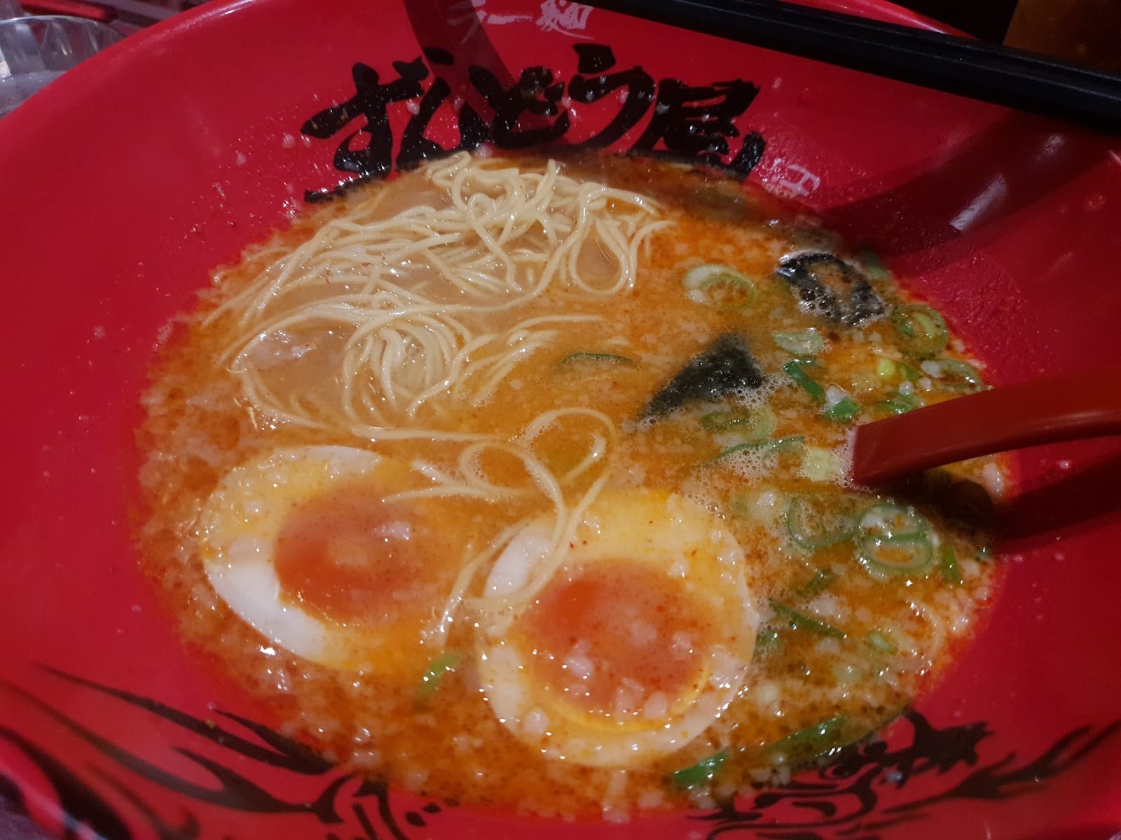 noodles and two soft-boiled eggs in Ramen Zundo-ya tonkotsu ramen