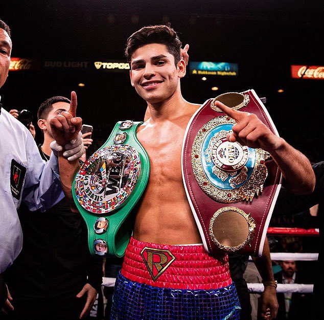 Ryan Garcia celebrates after beating Luke Campbell