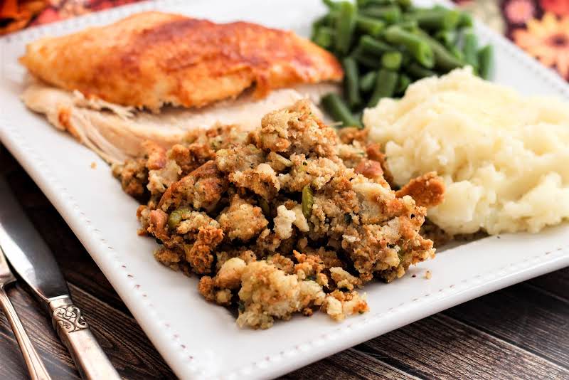 My Mom's Perfect Thanksgiving Stuffing On A Plate With Turkey And Mashed Potatoes.