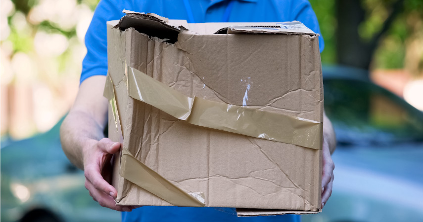 A damaged moving box handled by a moving company