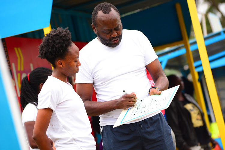 Blazers coach Jos Openda issues instructions to team captain Tracy Karanja during a league match at City park Stadium