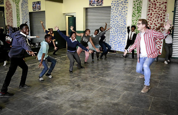 Ralf Schmitt, musical director of the Ndlovu Youth Choir, puts members through their paces ahead of the live rounds of 'America’s Got Talent'.