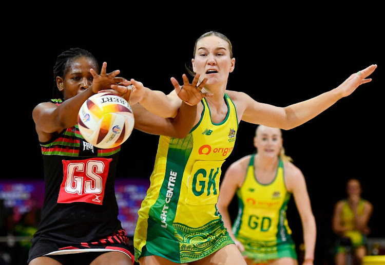 Joyce Mvula of Malawi and Sarah Klau of Australia during the Netball World Cup 2023 Pool F match at Cape Town International Convention Centre on Tuesday.