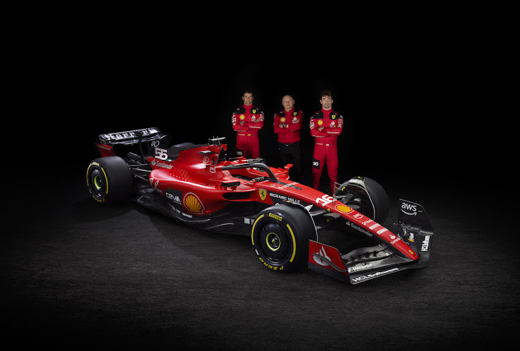 Carlos Sainz (left), Fred Vasseur (middle) and Charles Leclerc (right) with the new Ferrari SF23.