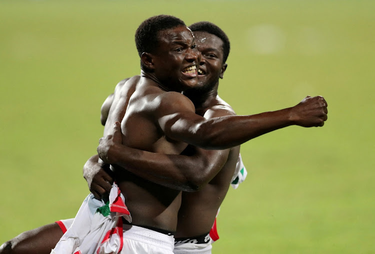 Burkina Faso's Ismahila Ouedraogo celebrate after scoring the winning penalty